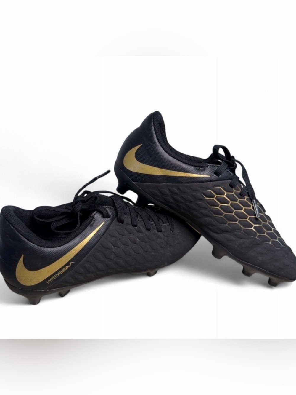Nike Black and Gold Athletic
Cleats in size 4Y